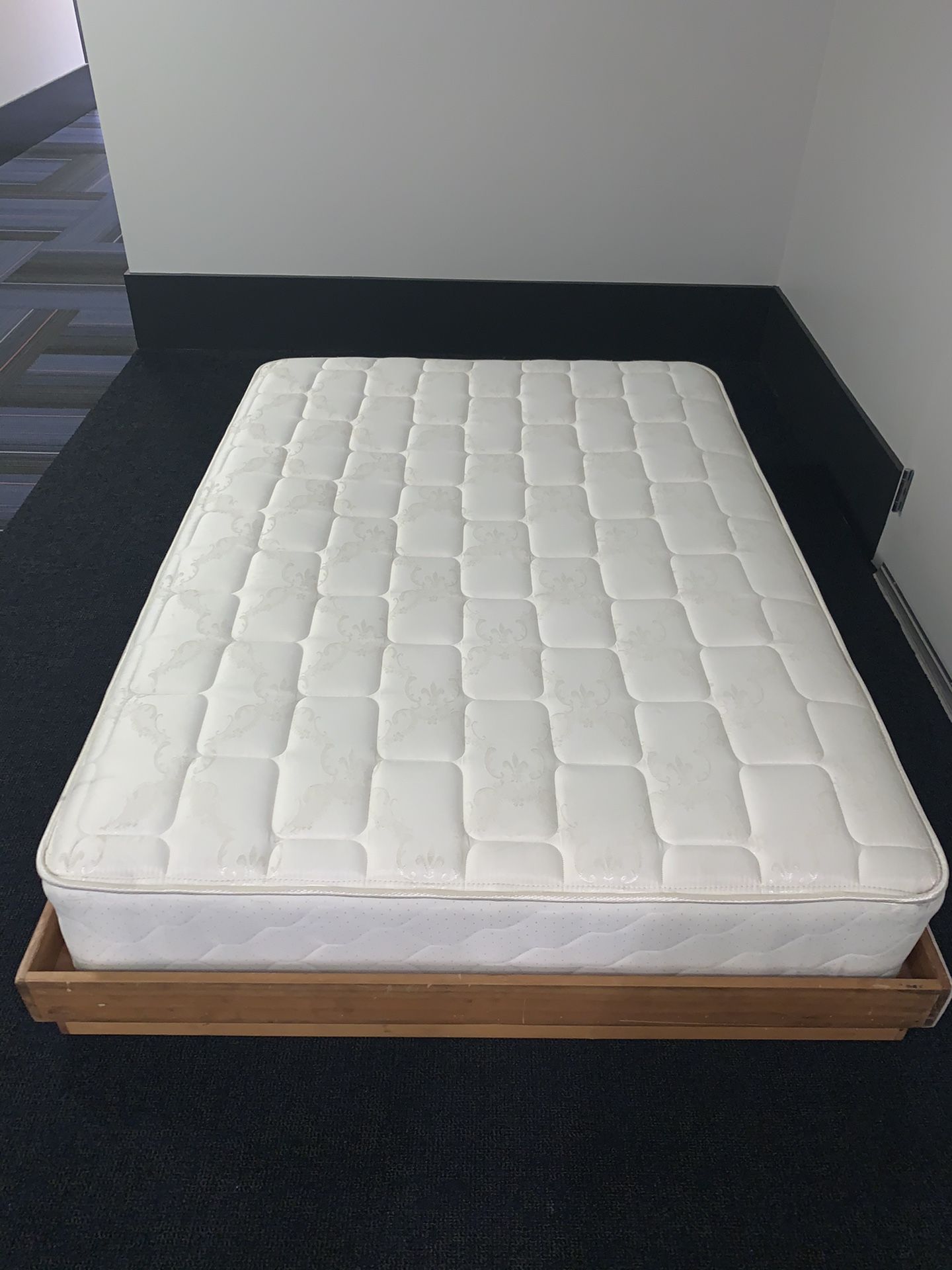 Great condition full size mattress and customized wood bed frame!