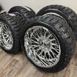 NEW 22x12 mirror chrome fittipaldi wheels wrapped in AMP TERRAIN RT 33x12.50r22 tires