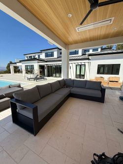Brand New Gorgeous high-end outdoor sectional in aluminum frame with charcoal cushions.