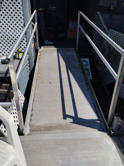 Aluminum wheelchair ramp and porch with rails