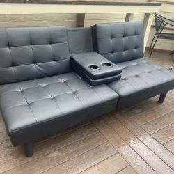 Black leather type futon couch