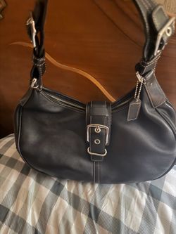 MOVING!!!!!! Beautiful black coach handbag. Excellent condition. Small dimple shown in last picture.