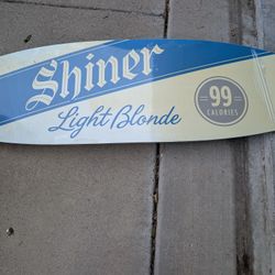 Shiner light beer surfing board sign