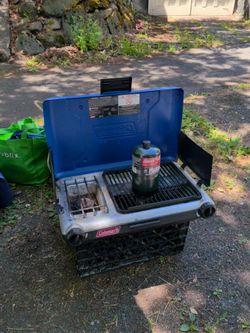 Nice coleman camp stove with drip tray and fresh propane tank