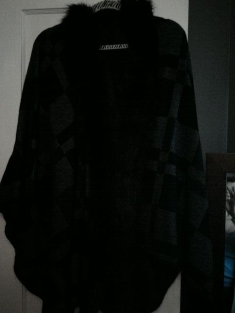 Beautiful poncho wore once, almost new 20.00