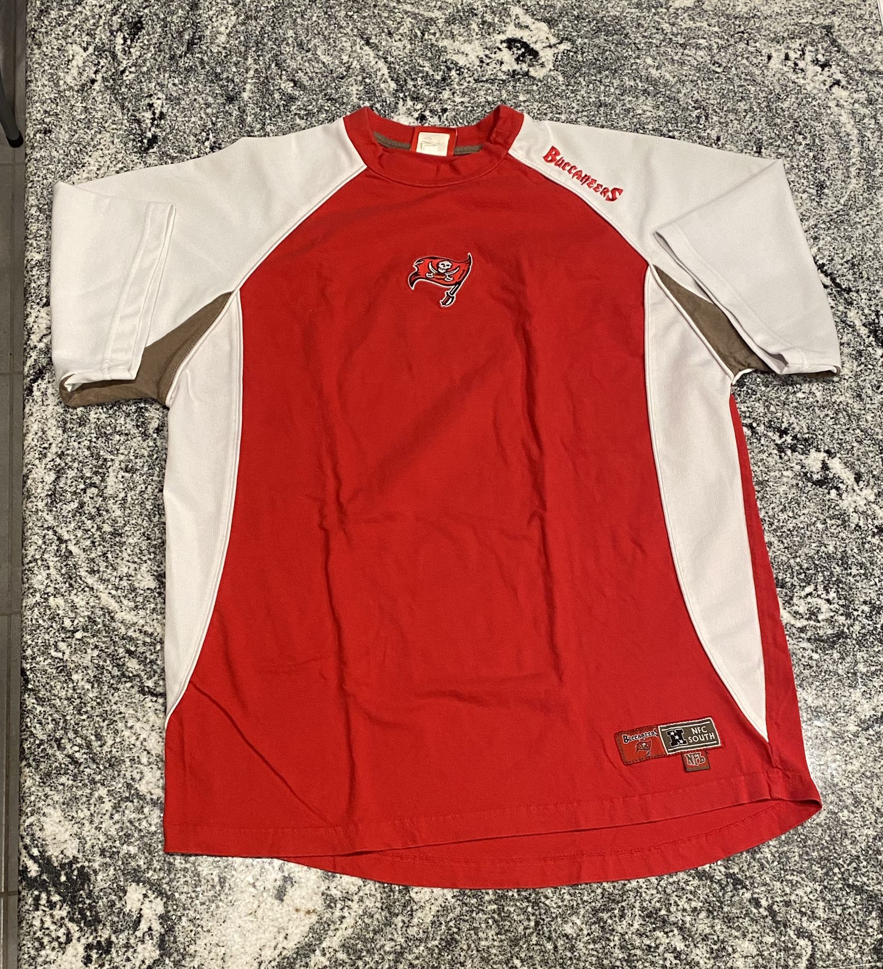Tampa Bay Buccaneers Red & White Jersey Shirt NFC South. Size Large. Official NFL Branded. Embroidered Buccaneers logo. Sleeves folded over for photos
