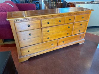 8-Drawer Wooden Chest with Antique Brass Knobs and Carved Accents