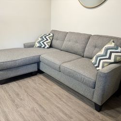 Sectional sofa with reversible ottoman chaise and pull out sleeper