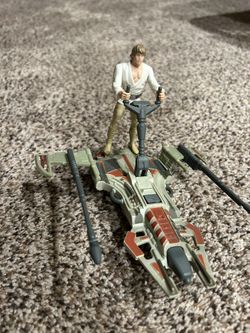 Luke Skywalker action figure with desert sport skiff