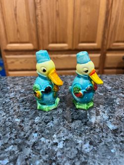 Vintage Old Blue Duck Pair of Salt and Pepper Shakers.  Hand Painted.  Made in Japan stamped Japan on the bottom.  Preowned missing stoppers.  Size ap