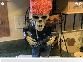 Gemmy Animated Halloween Dancing and singing biker skeleton with guitar looks and sounds great Runs on DC or batteries about 18” tall Plainfield, Illi