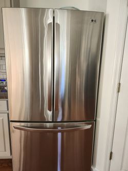 LG stainless steel 2 door refrigerator with a pullout freezer in excellent working condition