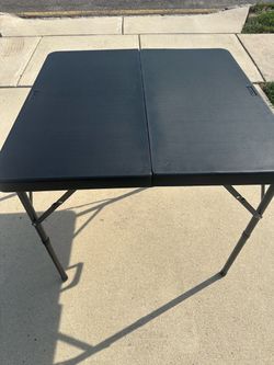 34” square folding table with carrying handle