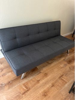 Futon - folds down to a small bed, soft fabric.