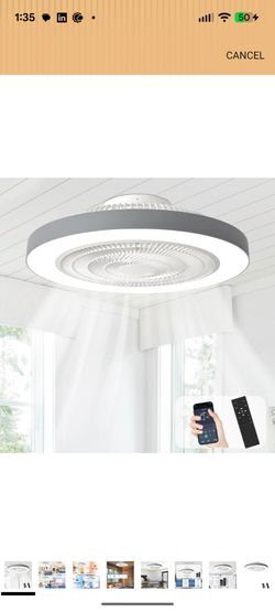 Modern ceiling fan with integrated LED light is white and grey. This low-profile fixture has a remote control and app compatibility for adjusting fan 