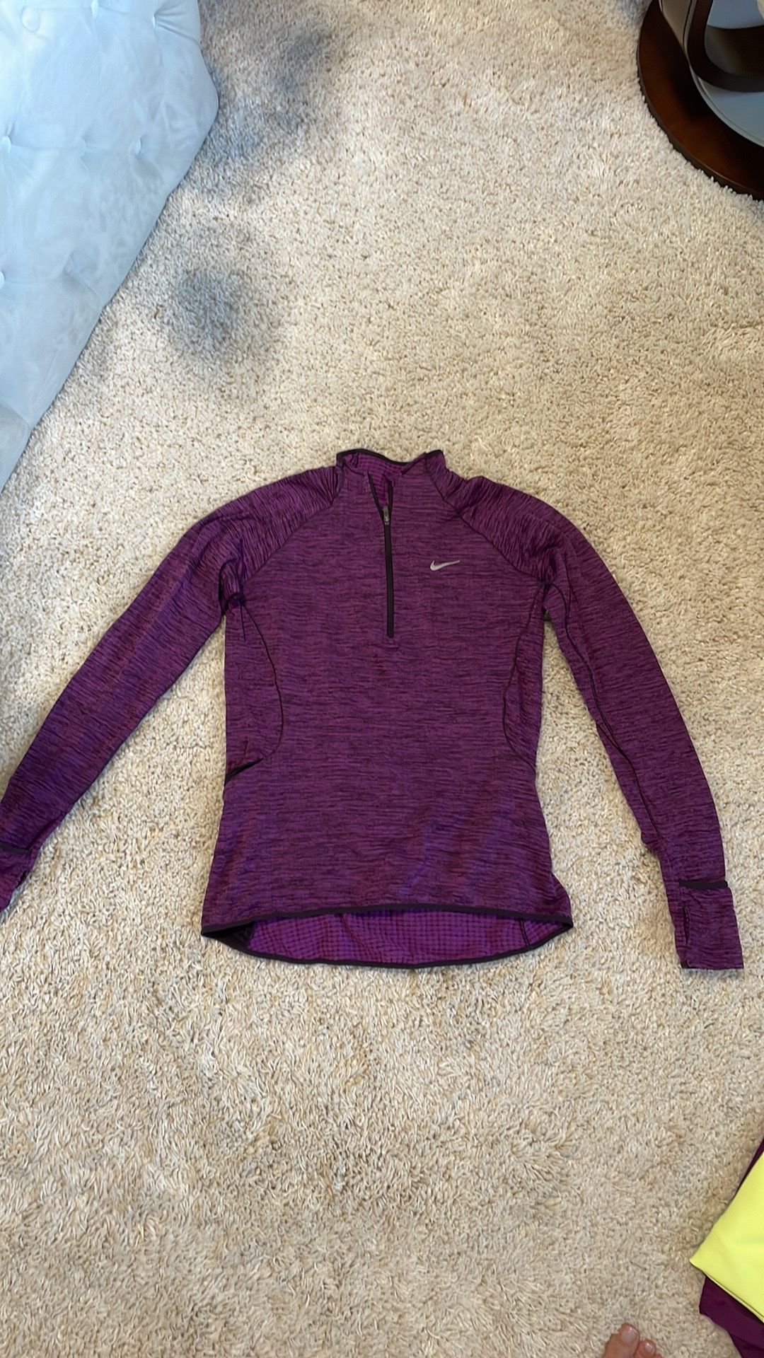 Nike dri fit purple black long sleeve top shirt women athletic xsmall like new Wore once like a thin fleece material inside. Zip side pocket