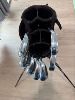 Like new irons, used golf bag (has rain hood)