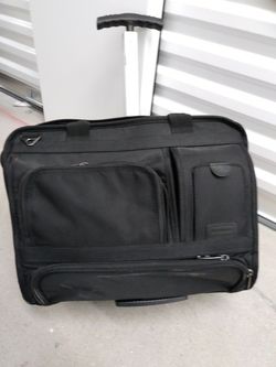 Multi-pocketed wheeled briefcase