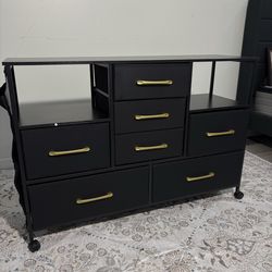 New in box 7 drawer table / dresser with rolling wheels and side pocket pouch