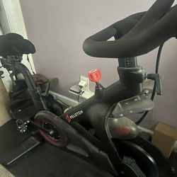 Peloton bike with multiple accessories