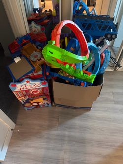 Box of hot wheels track and Spiderman organizer
