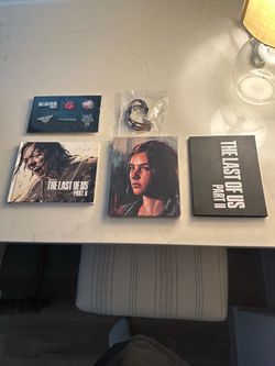 Last of us part 2 steelbook  with game book and pins and bracelet
