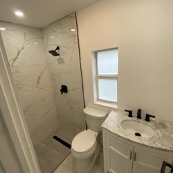 Bathroom Tile With Toilet And Beautiful Vanity 