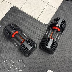Adjustable dumbells - (new)