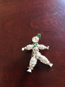 A rhinestone clown pin