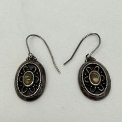 Silver earrings with pendants in boho or ethnic style