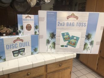 Margarita, game corn hole toss diss duel game and hook ring game all three of them $130 All brand new inbox.