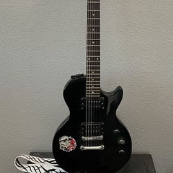 Epiphone Special II Les Paul 6 string guitar and Peavy amplifier