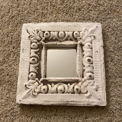 Small mirror with bracket on back