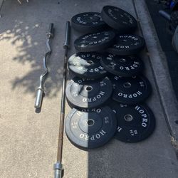 Olympic Weights Bumper Plates With Barbells 