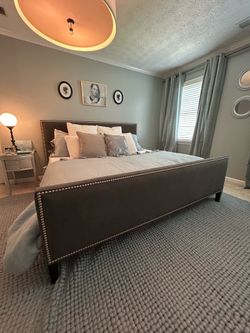 King size dark grey upholstered nailhead bed. Plus mattress and velvet curtains
