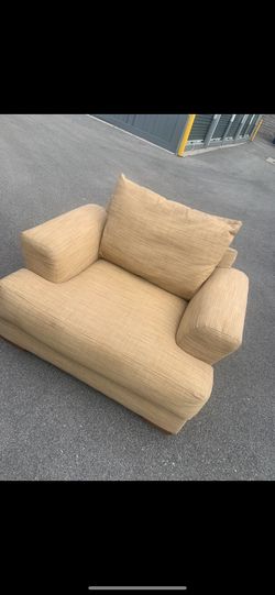 Tan Textured Armchair. oversized chair-and-a-half