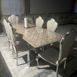 Dining Table + 6 Chairs" set with a marble top 