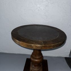 Rustic round wood pedestal side table with slate top