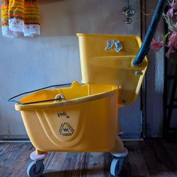 Label bucket with mop.