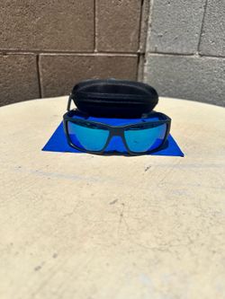 Costa del Mar Sun glasses for men polarized blue lenses blue and black frames