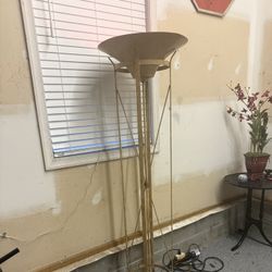   Tall Gold Torchiere Floor Lamp  Beautiful and very heavy metal floor lamp in good  condition. 70” tall with a gold finish and bowl top design. Uses 