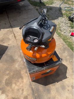 RIDGID 6 Gal. 150 PSI Portable Electric Oil-Free Jobsite Pancake Air Compressor with Dual Pressure Gauges and 2-Quick Couplers