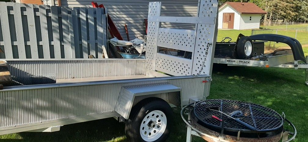 All aluminum trailer with wood floor new axle, new tires, seventeen twenty five