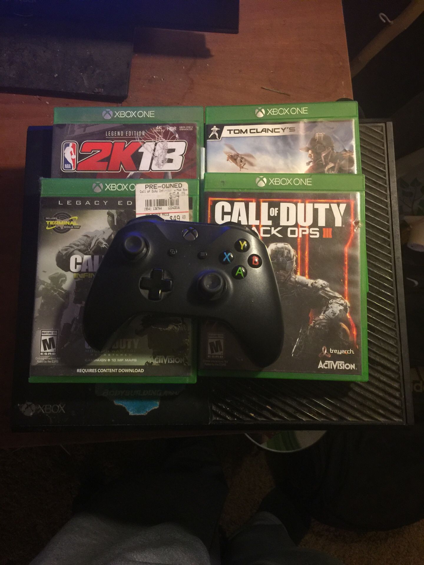 Xbox one with four games and controller