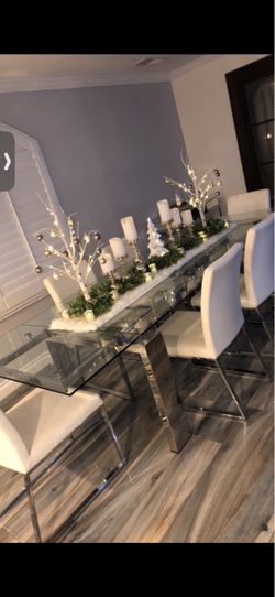 Modani Glass Dining Table + 8 White Chairs – $1,200
