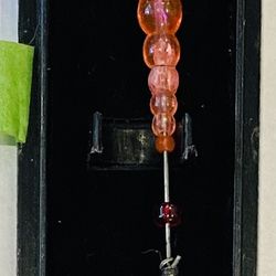 Long Red Fishing Lure in case