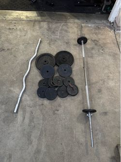 120lbs of standard weights plus cut bar and 6ft bar