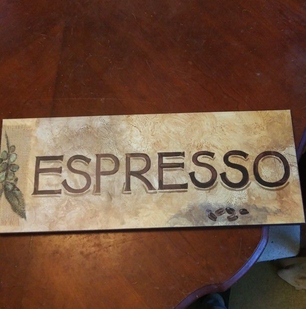 Elegant sign that reads "Espresso"