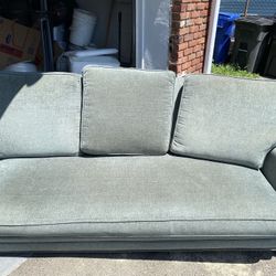 Teal Couch With Gold Studs