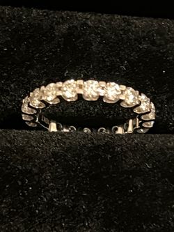Beautiful 2.2 moissanite fire round band 10 karat white gold. New and never worn have certification card.